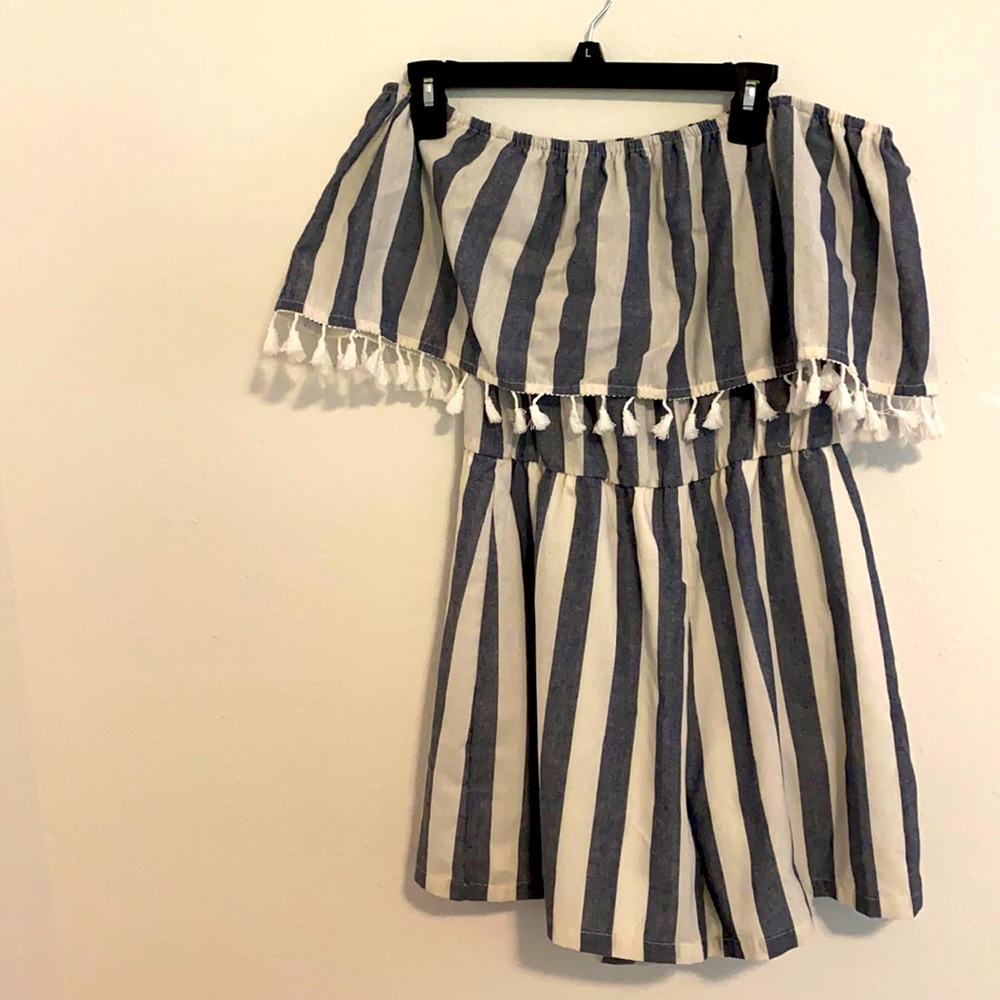 Size medium loose fit never worn striped romper.
